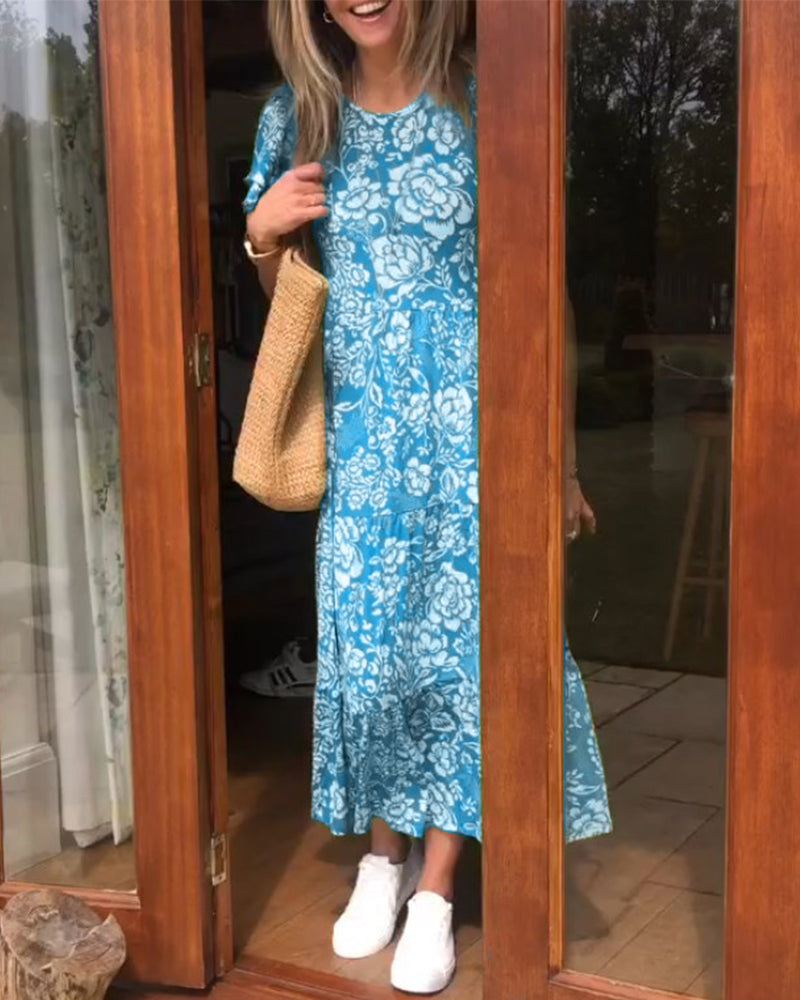 ByMoire. Lange jurk met korte mouwen en bloemenprint