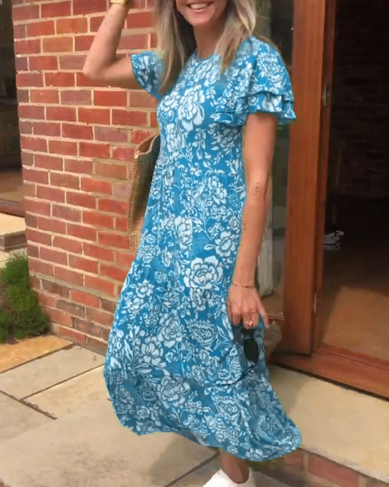 ByMoire. Lange jurk met korte mouwen en bloemenprint